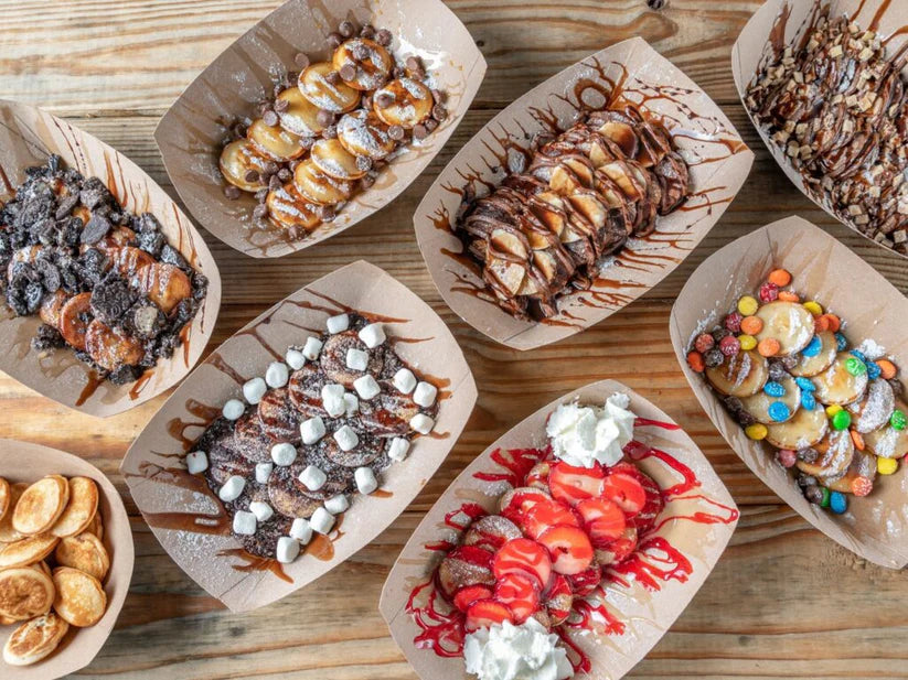 mini dutch pancakes served with chocolate sauce and fresh fruit