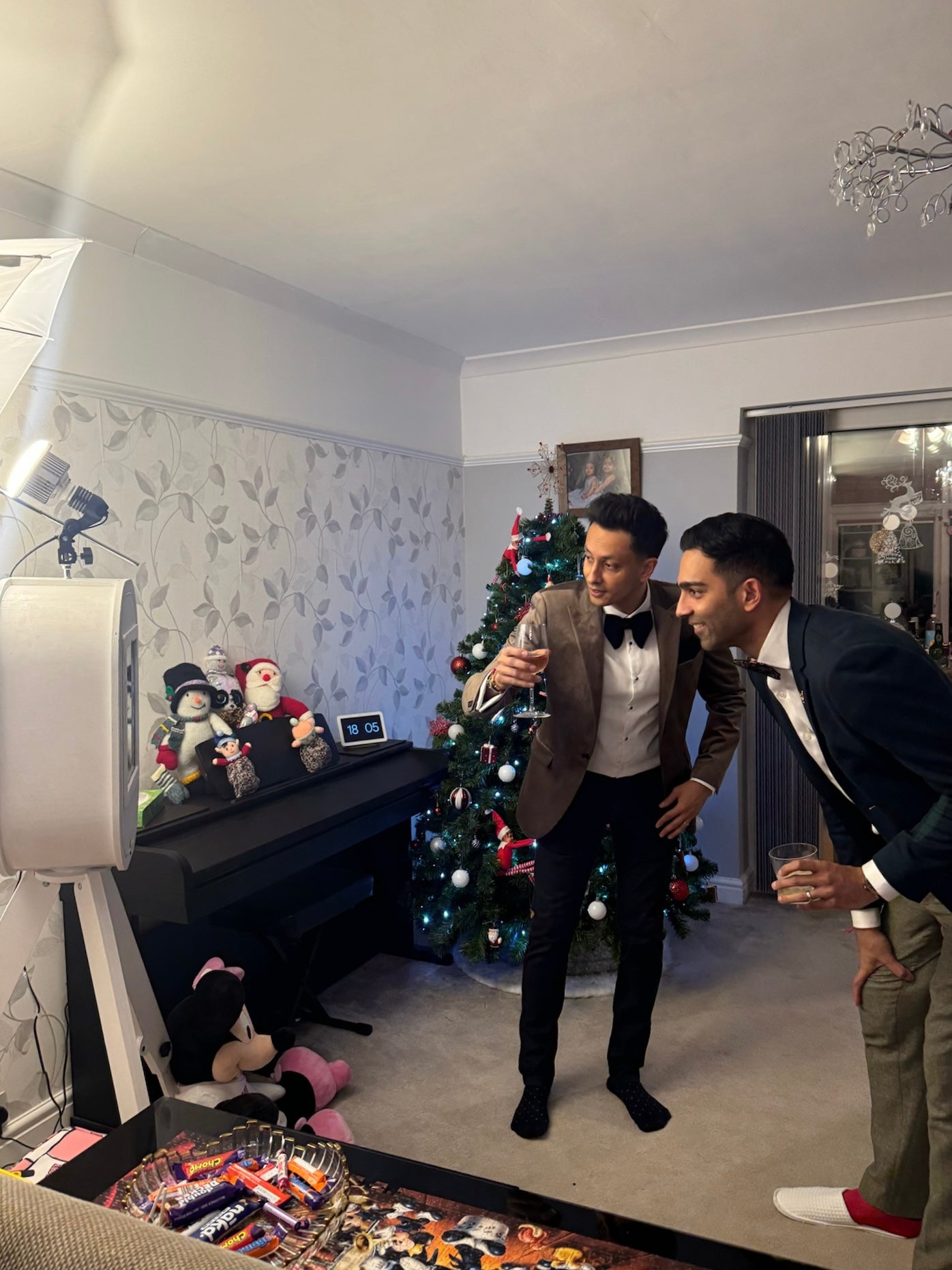 Guests posing for a picture using our selfie booth at a christmas party in warwick